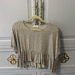Vestique patterned top